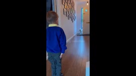 Son surprises daddy by wearing the school uniform for his first day of school