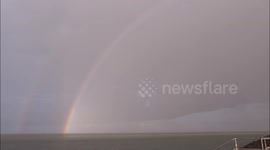 Stunning rainbow during heavy rain shower in Kent, UK