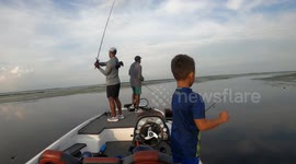 Dad Hypes His Son Up During Fishing Trip