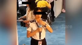 Airport security guard suspended for 'swallowing 300 USD wad of cash stolen from Chinese passenger' in the Philippines