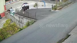 Car plunges 3 metres as driver presses accelerator by mistake, narrowly missing pedestrian in China