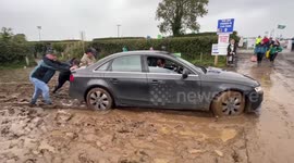 Cars struggle in muddy conditions at the Ploughing Championships in Co. Laois, Ireland