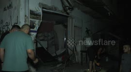 Palestinians inspect the damage inside a building destroyed during an Israeli army raid Nour Shams Camp