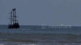 Pirate ship sailing in choppy waters