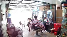 Brick falls on customer's head while she waits for friend at barber shop
