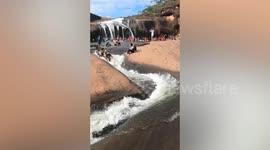 Rock formation becomes awesome natural waterpark when monsoon rains fall