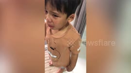 Little boy cries over parents' wedding photo as he thinks his father is with another woman