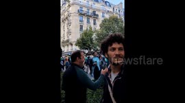 Protesters march through crowd of jubilant Ireland rugby fans in Paris