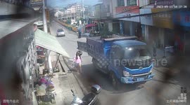 Chinese woman viciously struck by swinging truck door during routine trash run