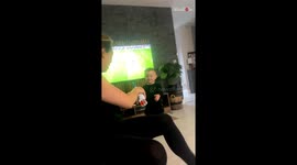 Mischievous 2 y/o boy thanks mum for Nerf gun by shooting her in the back with it!