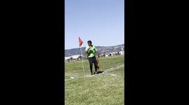 Pitch-perfect pint: Referee takes a break with a beer during Sunday soccer game in Oakland