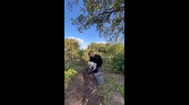 Man playfully tosses French Bulldog puppy in adorable mid-air catch game