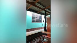 Hailstones shatter jalousie windows during storm in Thailand