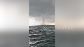 Massive waterspout rages off Thai coast amid storm clouds