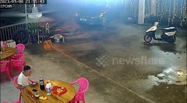 Chinese man narrowly escapes oncoming car that crashes through restaurant wall