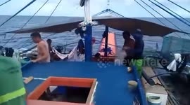 Filipino fishermen keep distance as Chinese Coast Guard ships patrol disputed waters