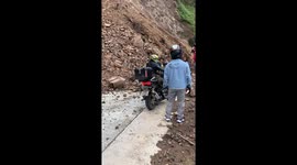 Mountain landslide blocks road amid storms in the Philippines