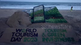 Sand artist's impressive tourism installation captures attention of beachgoers