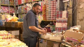 Palestinians buy Halawet el-Mawlid for celebrate the birthday of prophet Mohammad, at Al-Zawiya market in Gaza city.