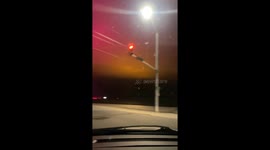 Enchanting aurora over Leamington, Canada, shines through clouds