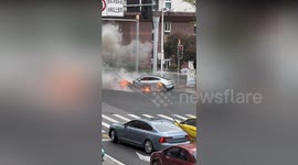 Firemen battle Porsche on fire on street in China