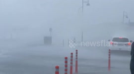 Sea spray soaks onlookers as Storm Agnes hits Irish coast with huge waves
