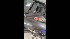 Shocked rider finds huge python coiled under motorcycle seat