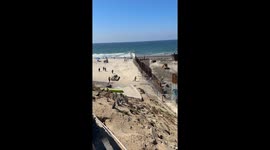 Migrants and Stray Dog Run Across Open US-Mexico Border Fence in Tijuana