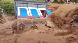 Toilet building collapses as raging flood erodes foundation