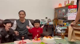 Little boy almost burns mouth trying to blow birthday cake's candle