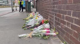 Flowers at the scene where a 15-year-old girl was fatally stabbed in Croydon, UK