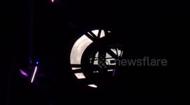 The September full moon known as the Harvest Moon seen with the London eye in the foreground