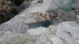 Thrilling drone shot above erupting geysir in prehistoric surrounding