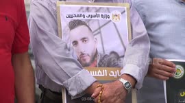 Palestinians take part in a protest in solidarity with prisoner on hunger strike, Kayed Al-Fafsous in front of the United Nations headquarters in Gaza City.