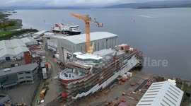Aerial footage of MV Glen Rosa and MV Glen Sannox ferries under construction at Ferguson Marine shipyard, Port Glasgow, Scotland, UK