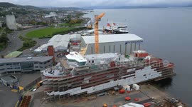 Aerial footage of MV Glen Rosa and MV Glen Sannox ferries under construction at Ferguson Marine shipyard, Port Glasgow, Scotland, UK