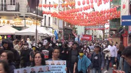 Protest against Chinese Communist Party marches through Chinatown in London on China's National Day