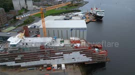 Aerial footage of MV Glen Rosa and MV Glen Sannox ferries under construction at Ferguson Marine shipyard, Port Glasgow, Scotland, UK