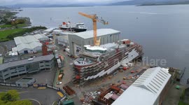 Aerial footage of MV Glen Rosa and MV Glen Sannox ferries under construction at Ferguson Marine shipyard, Port Glasgow, Scotland, UK