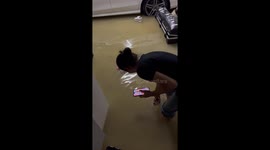 Resident shrieks as she fishes out shoes from dirty flood in basement
