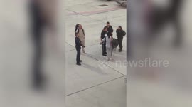Woman threw ''£5,000 in cash'' at man after they were escorted off a plane, passengers claim
