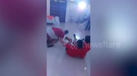Competitive siblings refuse to let go in hilarious 'boat is sinking' parlour game