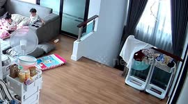 Sister saves her little brother from falling down the stairs