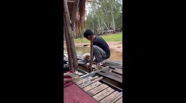 Sleepy puppy slips into river while playing with owner on raft