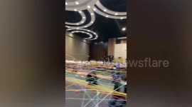 Students pass silk strings to teachers and friends to create massive web in school activity