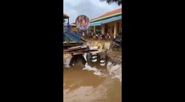Vietnam cleans up after floods leave homes and streets full of mud