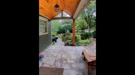 Large Bear Ready to Hibernate Lumbers Across Porch