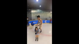 Bungling boyfriend crashes into people while pushing his partner on ice skating rink