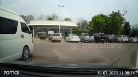 Pickup truck tries to reverse out of carpark and crashes into another vehicle