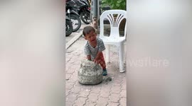 Overdramatic boy cries with arm stuck in concrete and pokes it back after rescue